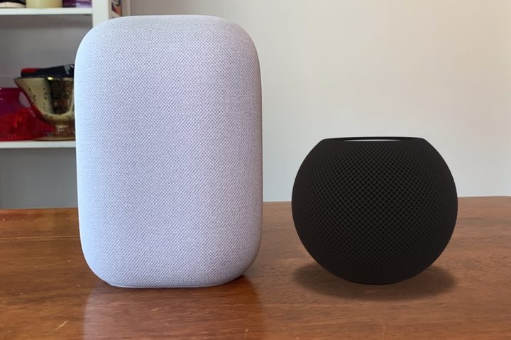 Apple HomePod mini render vs Google Nest Audio on table