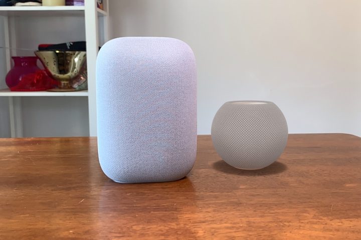Apple HomePod mini render vs Google Nest Audio on table