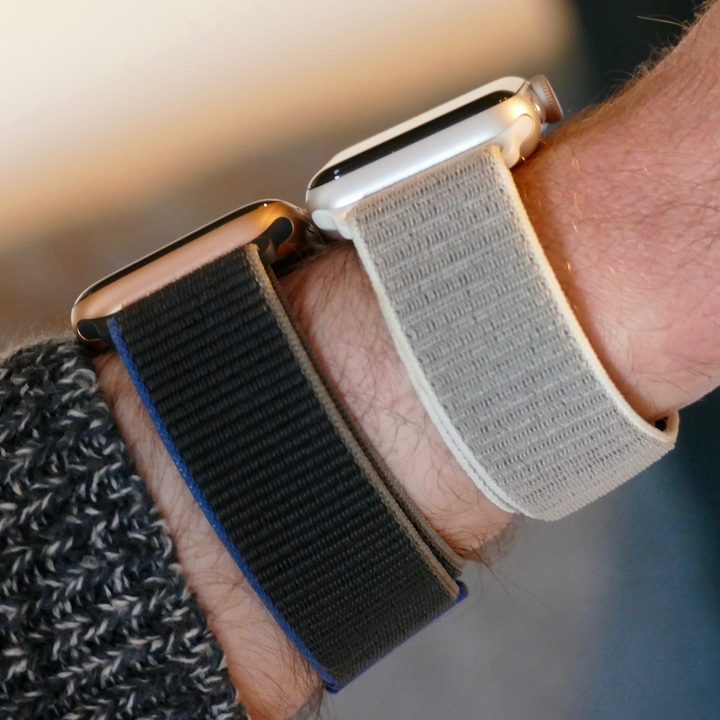Showing two different Apple Watch bands on wrist.