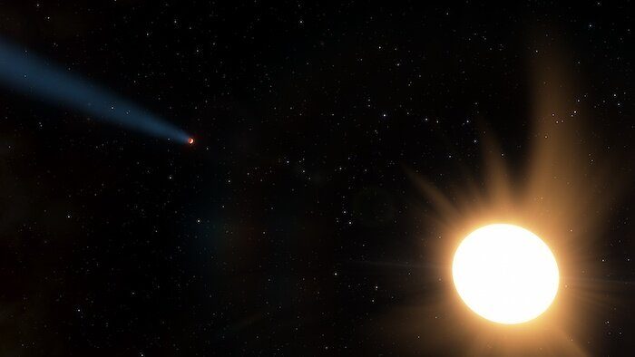 This artist's impression shows the LTT9779 system approximately to scale, with the hot Neptune-sized planet at left and its bright, nearby star at right. The trail of material streaming off of the planet is hypothetical but likely, based on the intense irradiation of this planet.