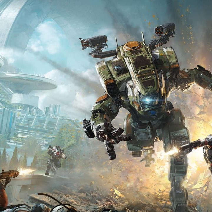A pilot standing in front of a titan with a sword in the ground.