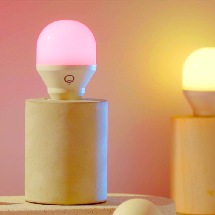 Group of LIFX colored bulbs in exposed bulb desk lamps