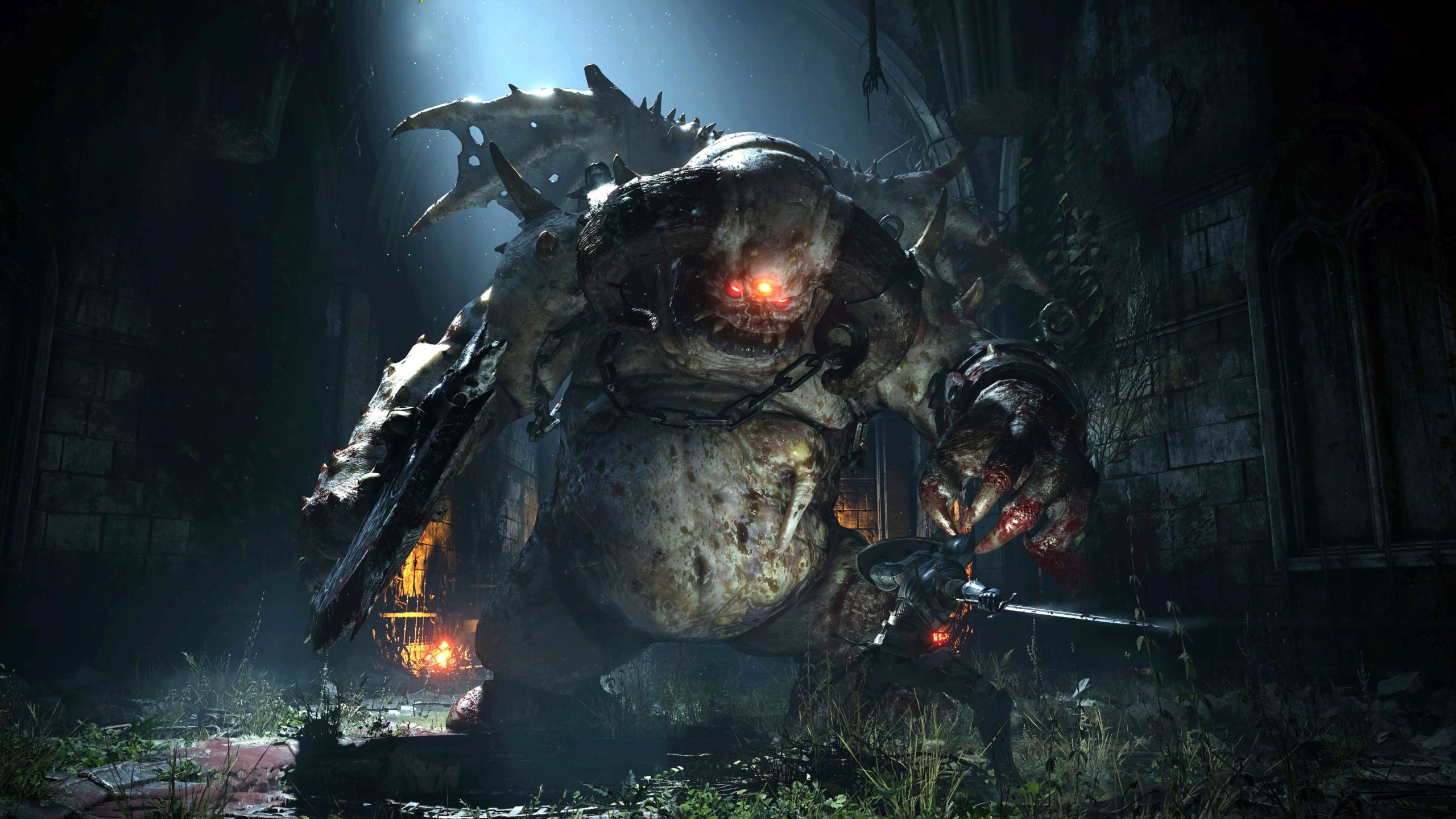 The protagonist of Demon's Souls going up against a massive creature.