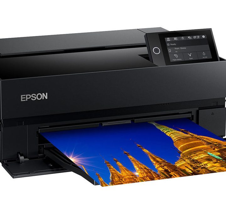 Epson SureColor P700 Printer with a brightly colored photo print coming out of its front.