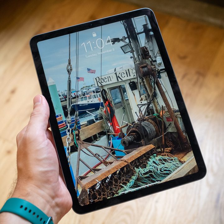 The iPad Air 4 in hand.