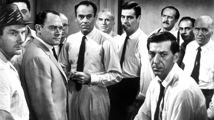 A group of men in 12 Angry Men.