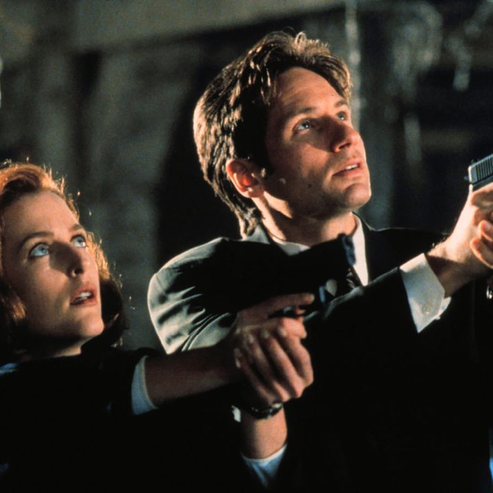 A man and a woman point guns up in The X-Files.