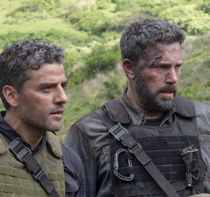 Oscar Isaac and Ben Affleck stand next to each other as soldiers in Triple Frontier.