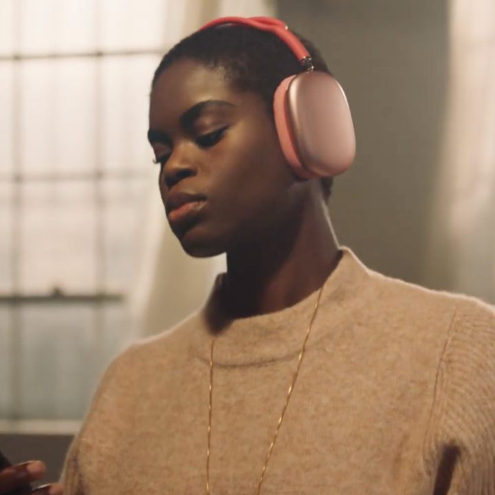 Woman wearing Apple Airpods Max.