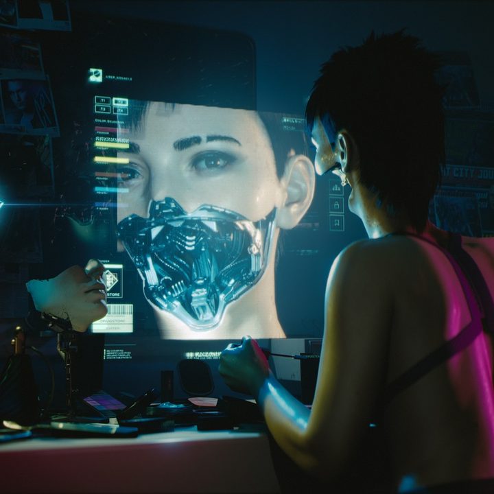 A hacker uses a computer in Cyberpunk 2077.