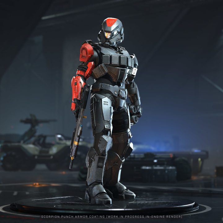 A multiplayer spartan standing in a hangar.