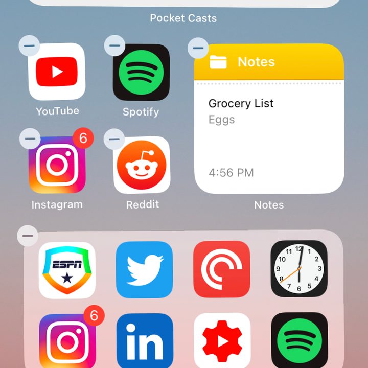 iPhone home screen with apps and widgets in jiggle mode.