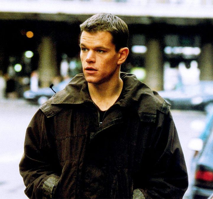 Matt Damon walks down the street in The Bourne Identity.