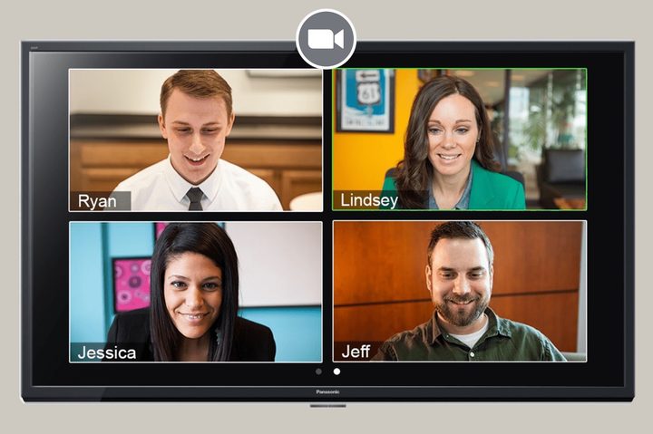 Zoom video call showing participants looking down at screens