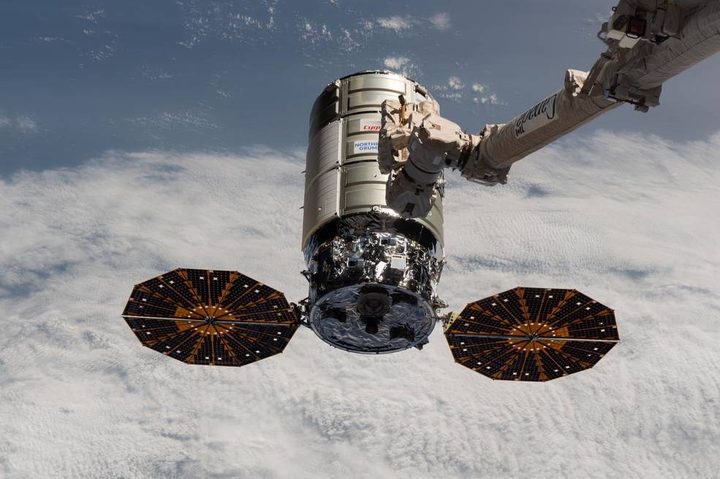 Northrop Grumman’s Cygnus space freighter approaches the International Space Station where the Canadarm2 robotic arm is poised to capture it for docking.