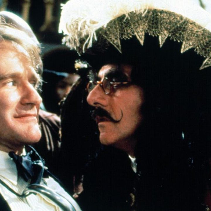 Captain Hook stares into the eyes of Peter Pan.