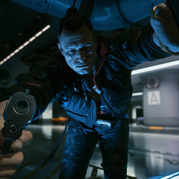 A dude in a mohawk points a gun at the player.