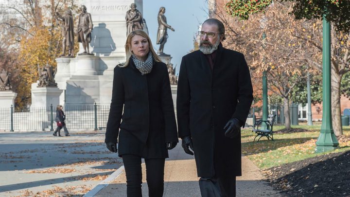 Carrie and Saul walking down the street in a scene from Homeland.