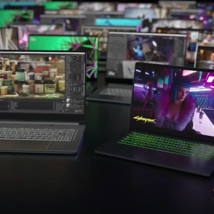 Rows of gaming laptops displayed with lids open.