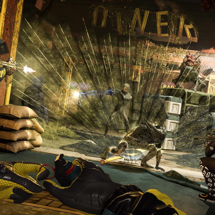 A squad attacks an alien in Rainbow Six Extraction.