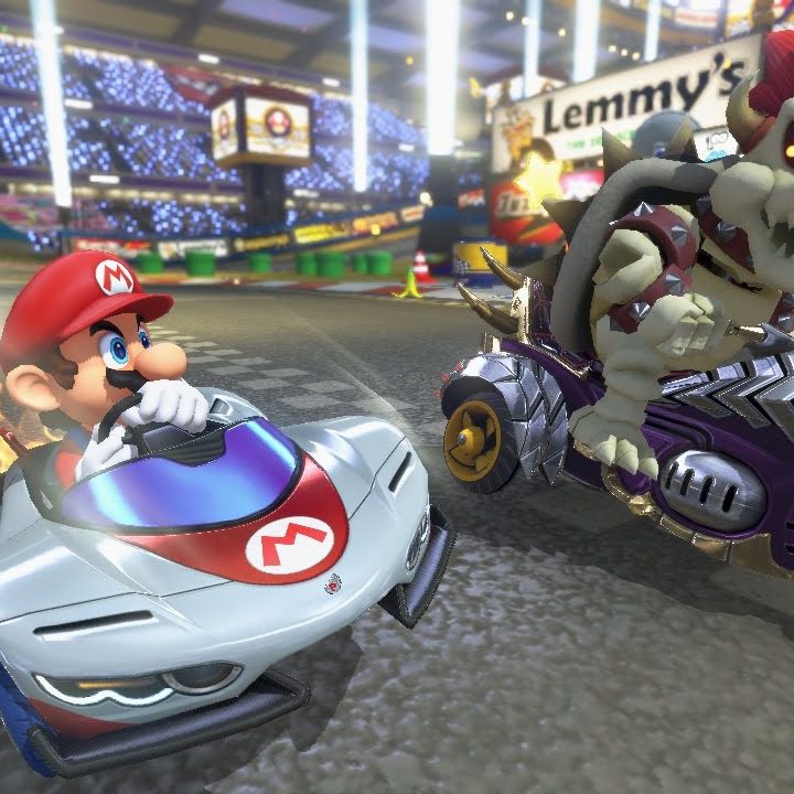 Mario and skeleton Bowser racing on the track.