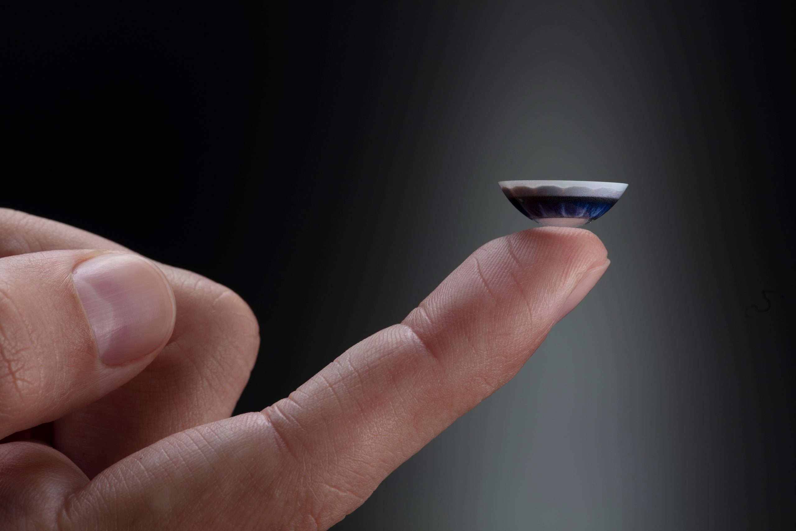 augmented reality contact lenses vision mojo lens on finger