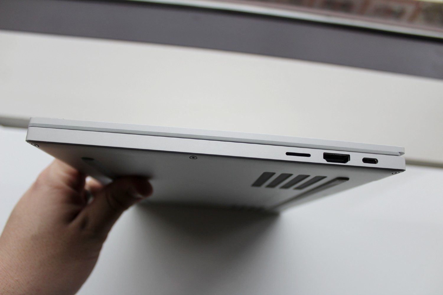 Razer Book 13 side view showing ports and bottom venting.