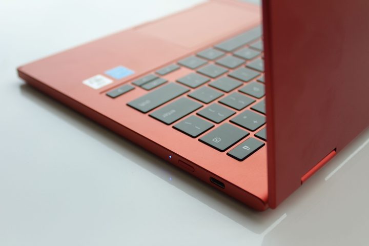 A red Samsung Galaxy Chromebook 2 sits open on a table.
