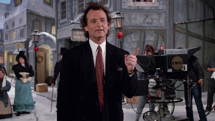 A man stands on a set in Scrooged.