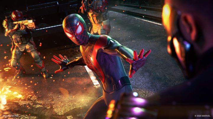 Miles Morales in Spider-Man outfit fending off crime