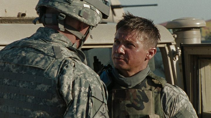 Jeremy Renner looks up at someone in a scene from The Hurt Locker.