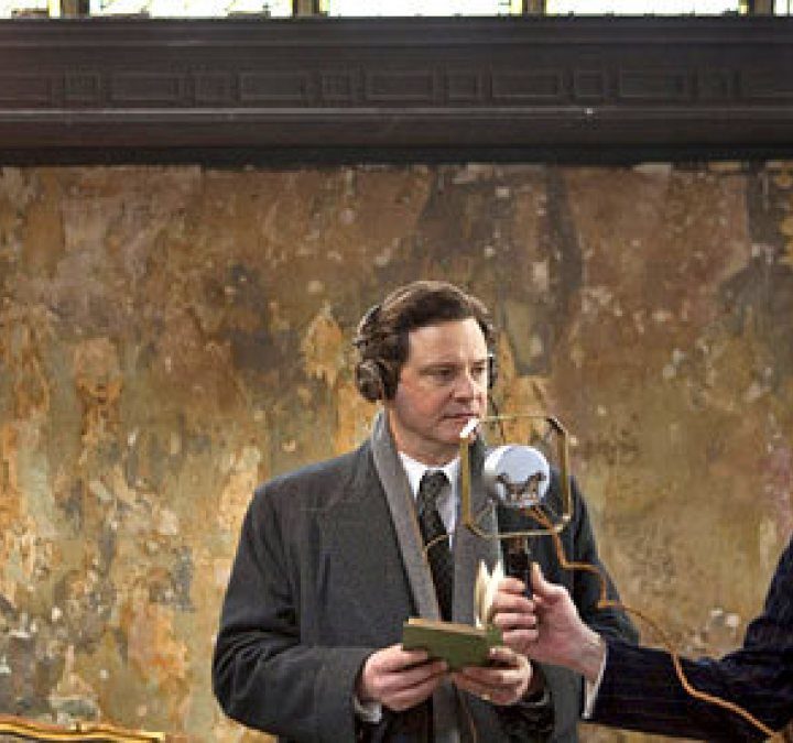 King George VI speaking into a microphone in The King's Speech.
