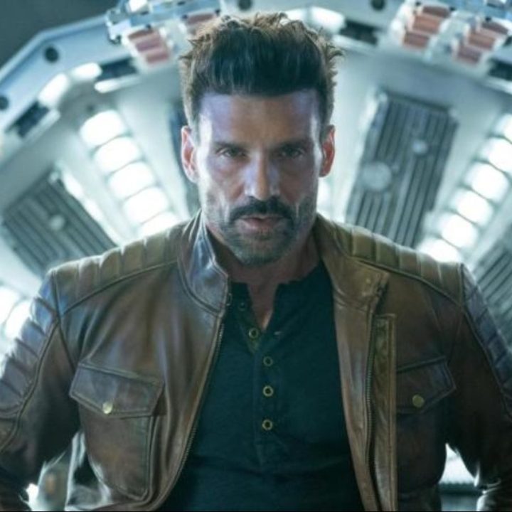 Franl Grillo stands in front of a time machine.