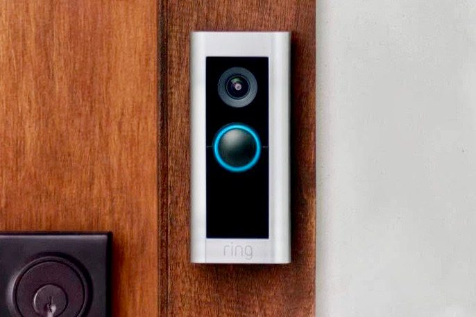 Ring Video Doorbell Pro 2 on a wooden door.