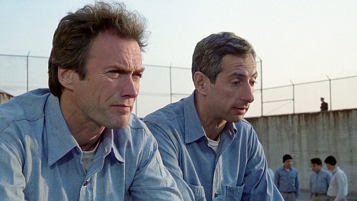 Clint Eastwood talks to a man in Escape From Alcatraz.