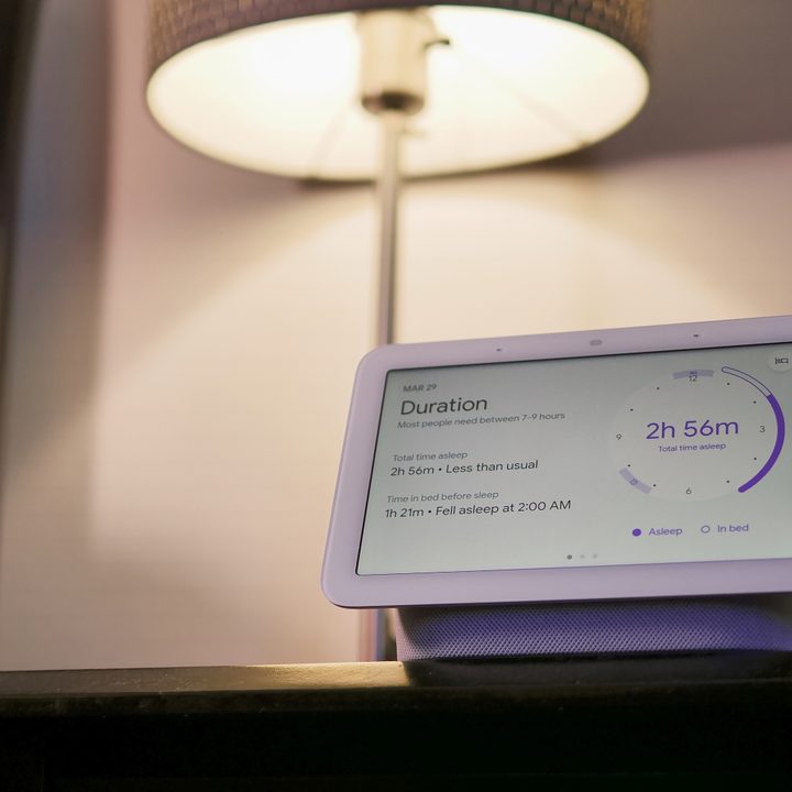 The 2nd Gen Nest Hub on a bedside table.