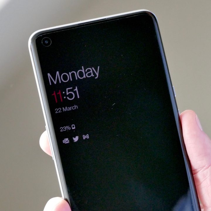 OnePlus 9 Pro in a person's hand.
