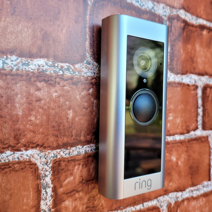 Ring video doorbell Pro 2 against brick surface.
