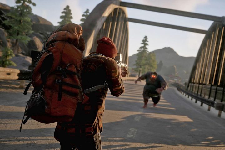 A man shoots a zombie in State of Decay 2.