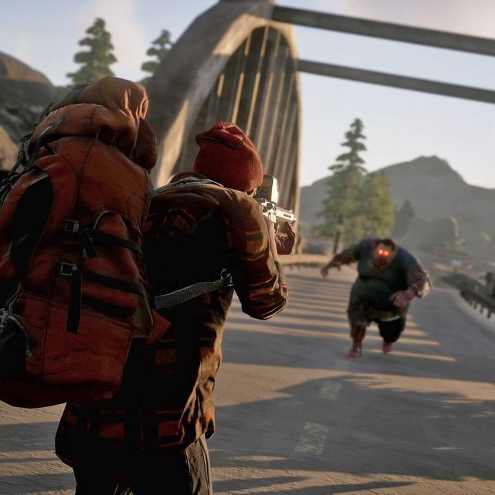 A man shoots a zombie in State of Decay 2.