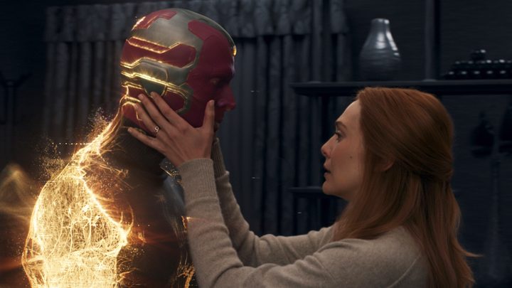 A woman holds a robot in WandaVision.