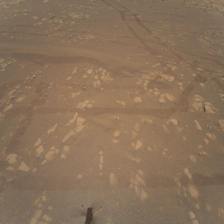 This is the first color image of the Martian surface taken by an aerial vehicle while it was aloft. The Ingenuity Mars Helicopter captured it with its color camera during its second successful flight test on April 22, 2021. At the time this image, Ingenuity was 17 feet (5.2 meters) above the surface.