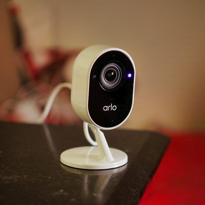 Arlo Essential Indoor Security Camera on table.