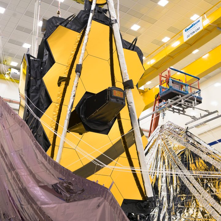 Both sides of the James Webb Space Telescope's sunshield were lifted vertically in preparation for the folding of the sunshield layers.
