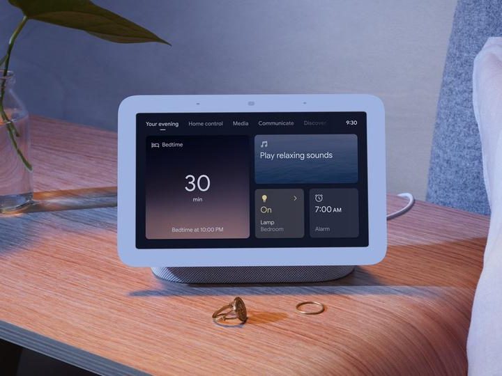 The Google Nest Hub with night mode displayed.