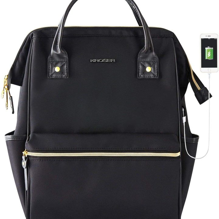 Kroser backpack with charging phone hooked up to it all on a white background.