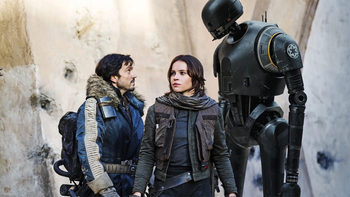 Diego Luna, Felicity Jones, and the droid K-2SO in a scene from Rogue One.