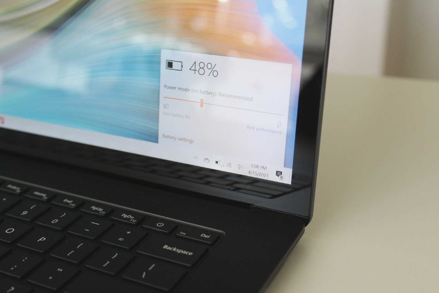 Surface Laptop 4 side view showing upper right of keyboard deck and lower right of display.