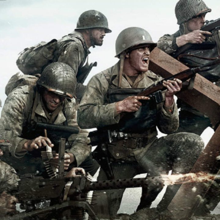 Soldiers storming the beach at Normandy.