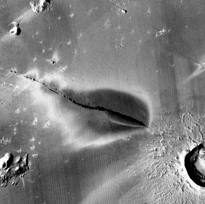Recent explosive volcanic deposit around a fissure of the Cerberus Fossae system.